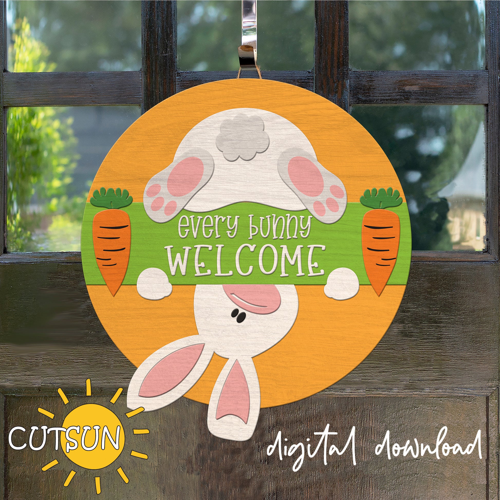 Decorative door hanger with bunny design and 'Every Bunny Welcome' text on a wooden background.