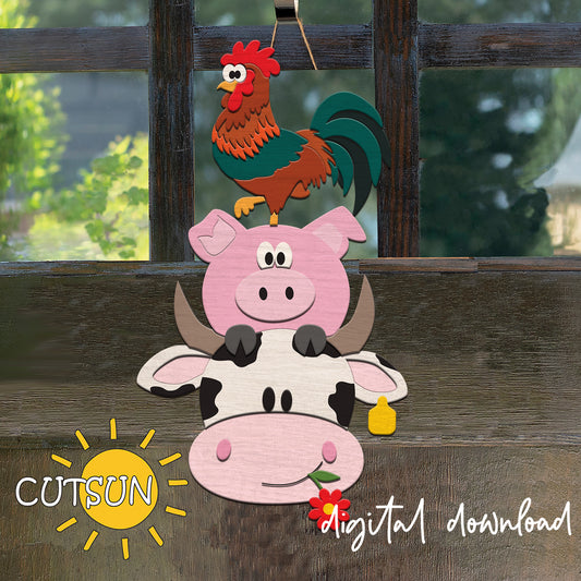 Decorative cutout of a cow, pig, and rooster on a wooden surface with 'CUTSUN' branding.