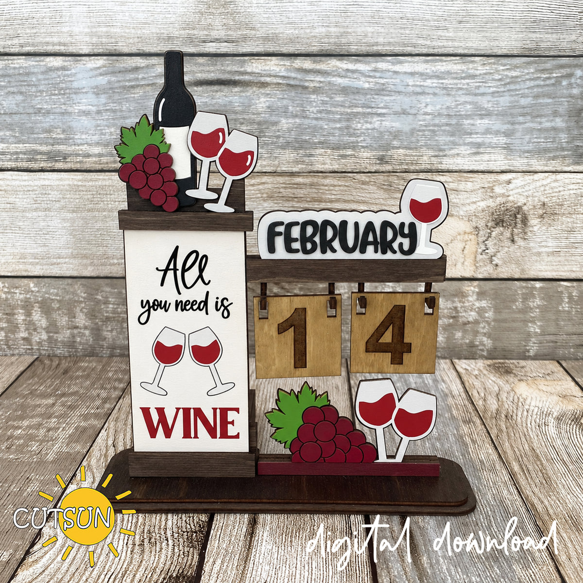 Wooden desktop calendar with a February wine glass sign, wine bottle topper, “All you need is WINE” panel, and burgundy grape decorations.
