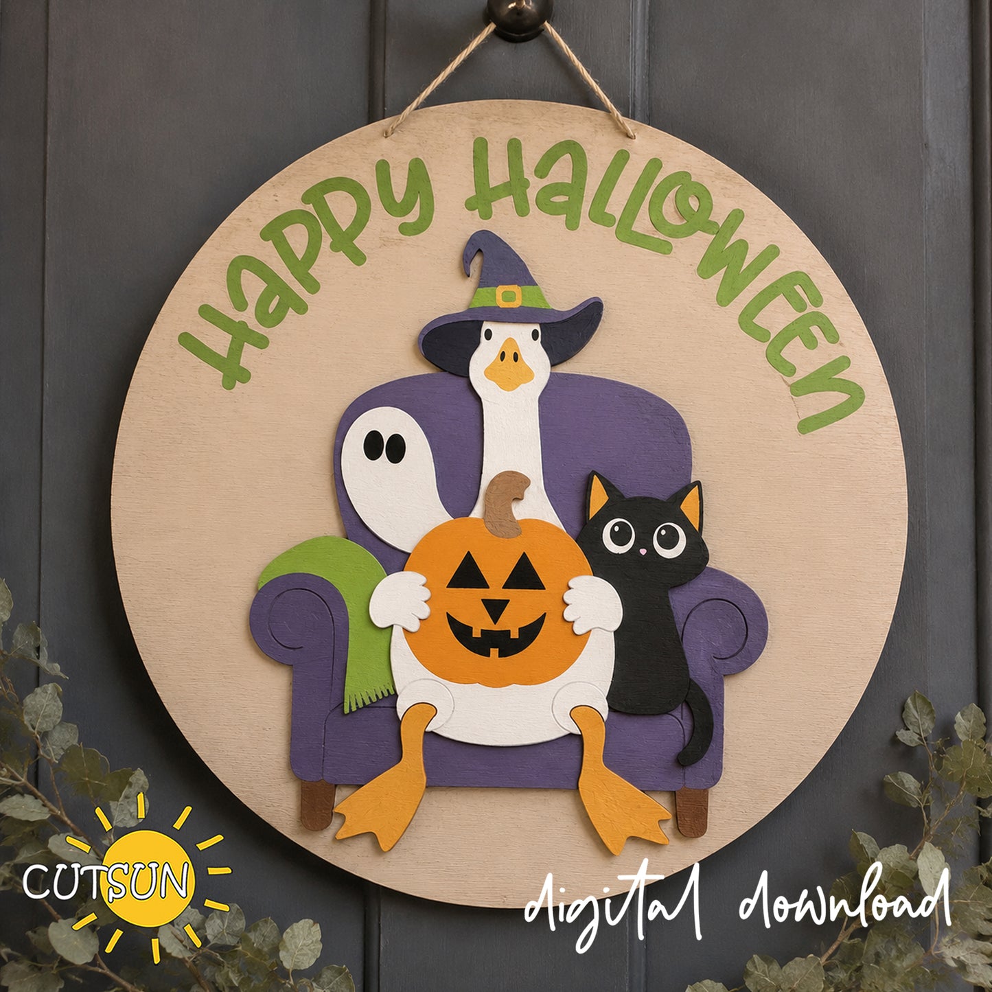 Layered wooden Halloween door hanger featuring a goose in a witch hat sitting in a purple chair with a ghost, black cat and jack-o’-lantern under green Happy Halloween lettering.