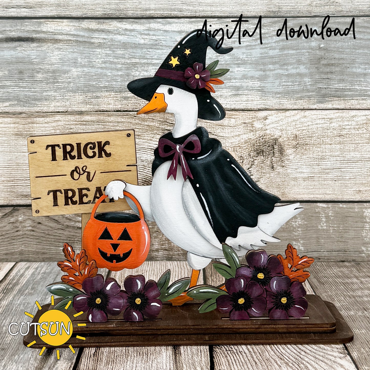 Halloween goose shelf sitter SVG featuring a witch goose holding a pumpkin candy bucket beside a Trick or Treat sign with fall flowers and leaves.