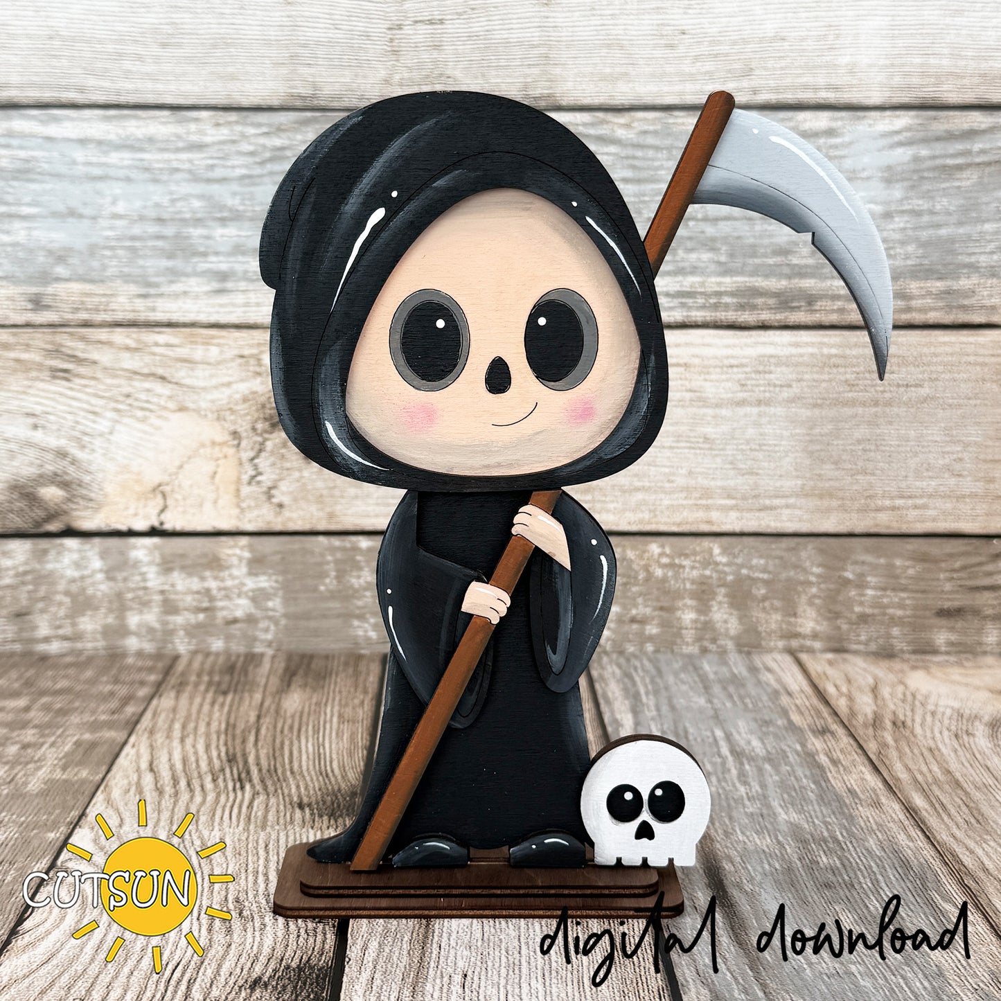 Cute Grim Reaper shelf sitter laser cut file featuring a smiling hooded reaper holding a scythe with a small skull at its feet, approximately 8 inches tall.