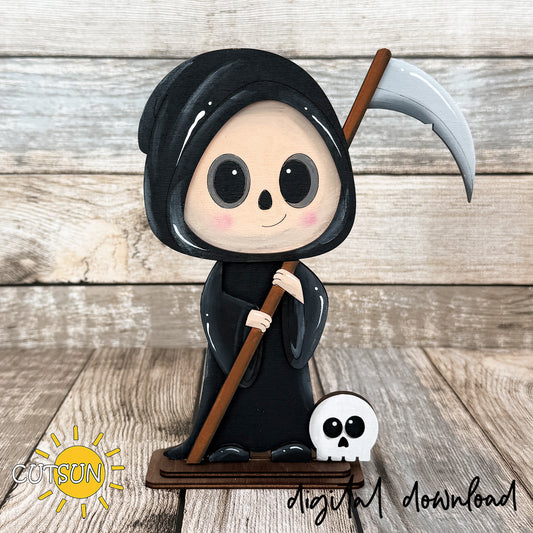 Cute Grim Reaper shelf sitter laser cut file featuring a smiling hooded reaper holding a scythe with a small skull at its feet, approximately 8 inches tall.