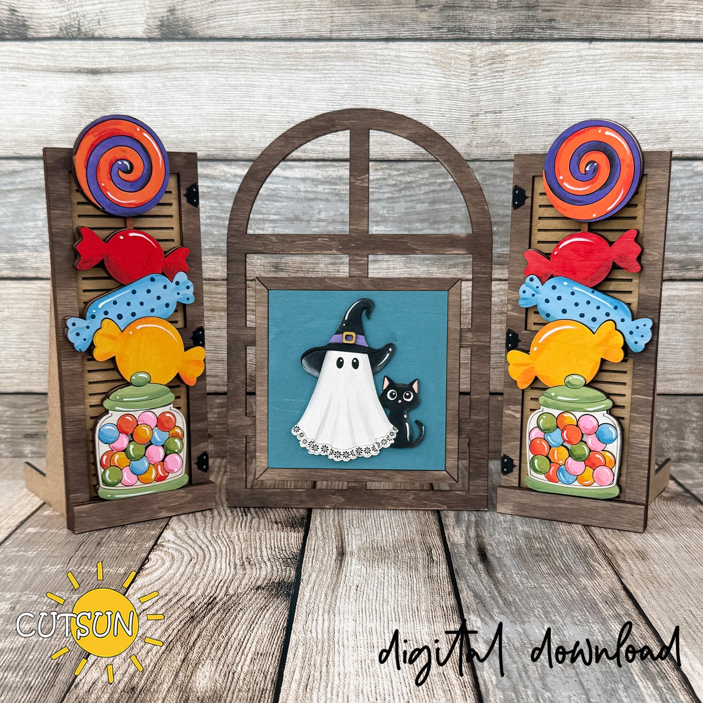 Interchangeable Halloween Farmhouse Window add-on featuring a cute ghost in a witch hat, a black cat, colorful candy jars, wrapped candies, and oversized lollipops for layered laser-cut décor.