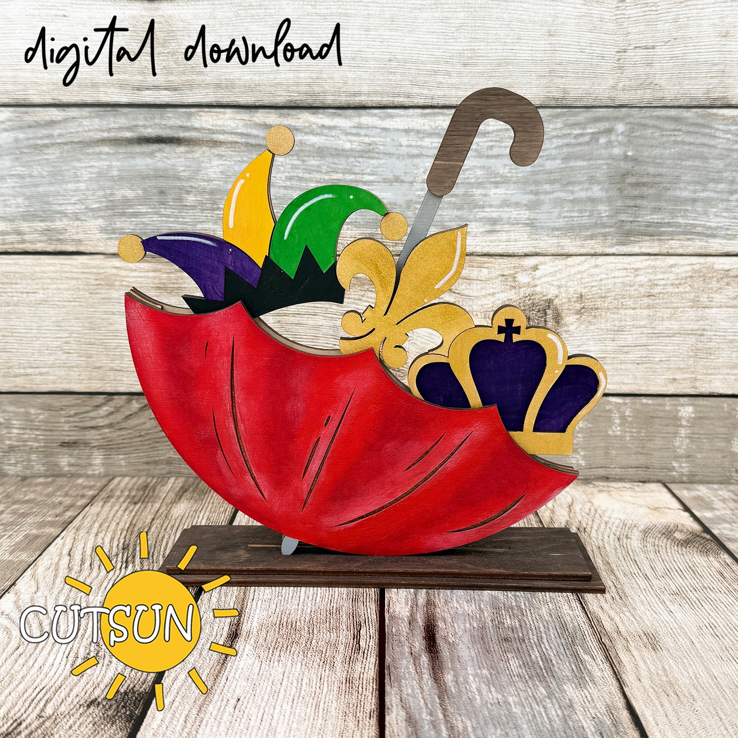 Mardi Gras add-on for interchangeable upside down umbrella shelf sitter featuring jester hat, fleur-de-lis, and crown in purple, green, and gold layered laser cut design