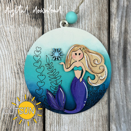 Mermaid Christmas ornament SVG design with snowflake and seaweed, layered laser cut file for ocean-inspired holiday décor.
