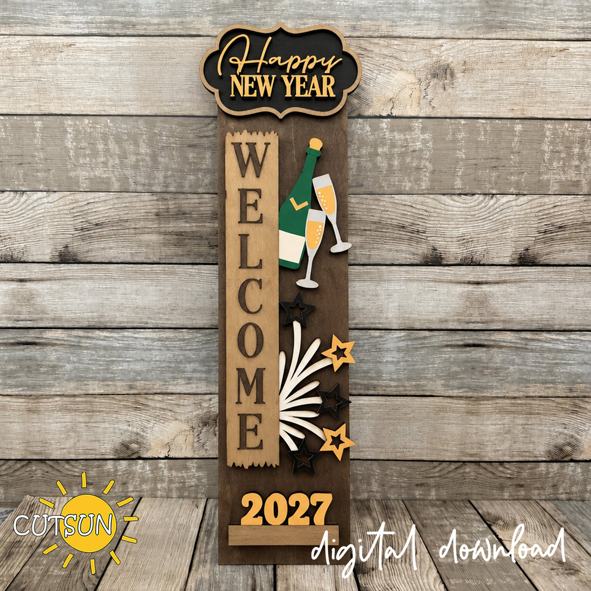 Layered Happy New Year add-on displayed on a dark-stained wooden interchangeable vertical porch leaner, featuring champagne glasses, a bottle, fireworks, stars and the year 2027.