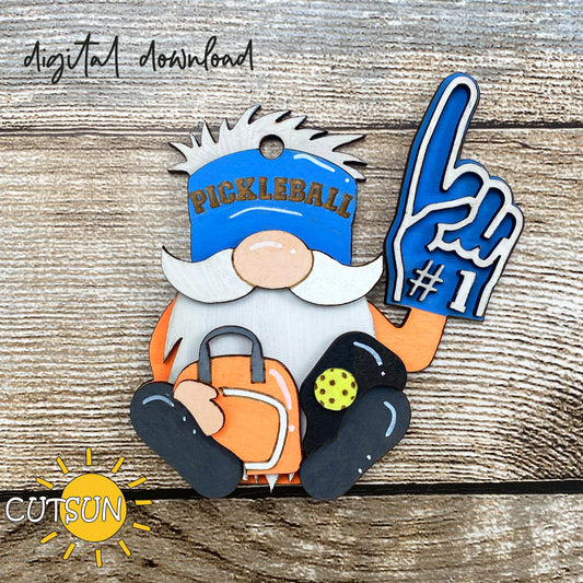 Digital download for a cute gnome ornament featuring a pickleball player with a hat, a bag, a paddle and a ball, and a foam hand.