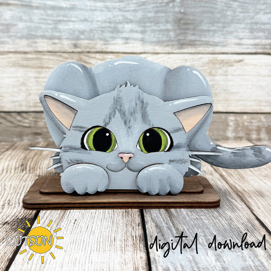 Layered cat shelf sitter SVG featuring a sitting kitty with oversized paws, expressive eyes, and farmhouse-style laser cut details displayed on a stand.