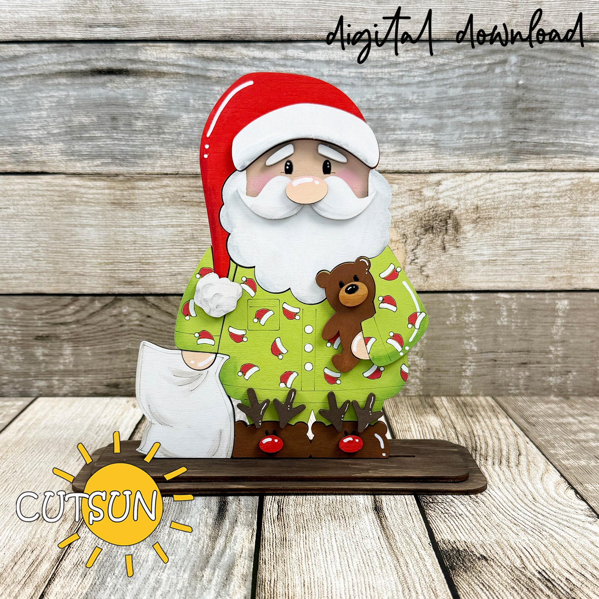 Santa in Pajamas shelf sitter SVG laser cut design featuring a standing Santa with teddy bear, gift sack and reindeer slippers on a wooden base.