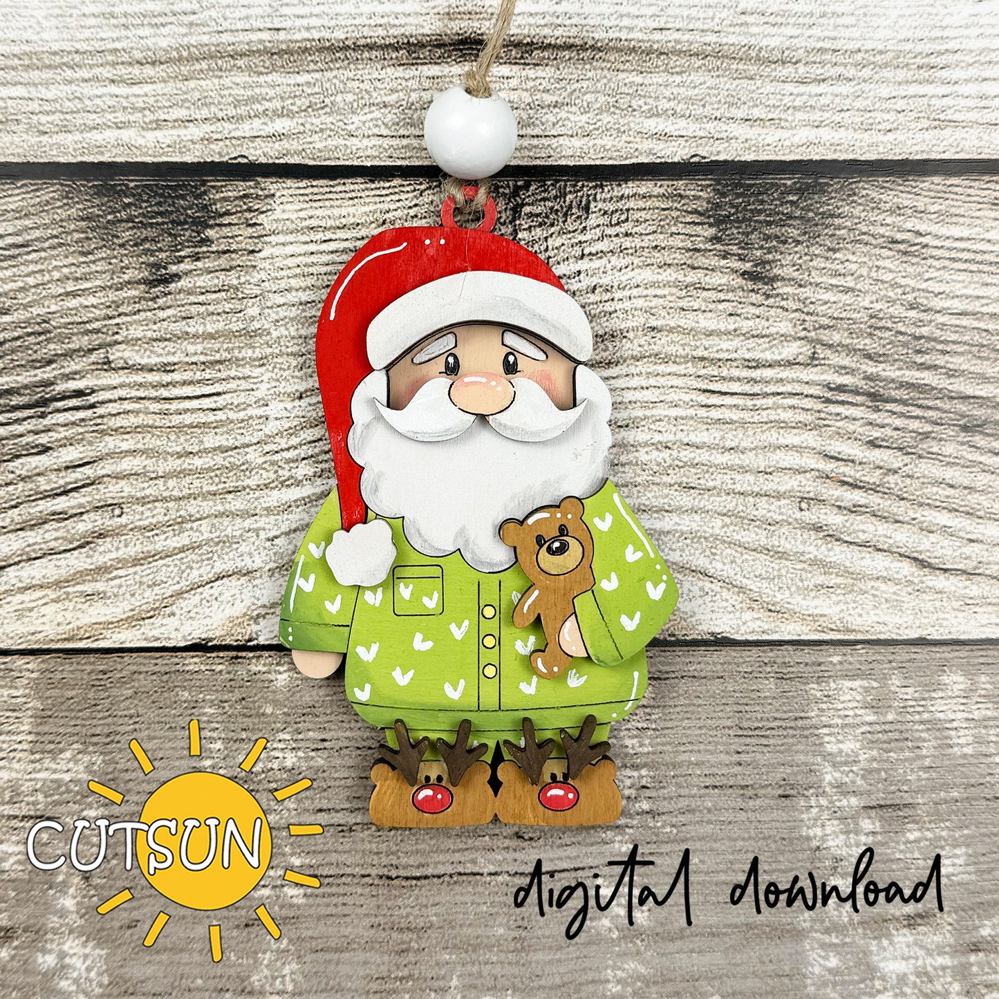 Santa in Pajamas Ornament SVG – Christmas laser cut file featuring Santa in festive pajamas with teddy bear and reindeer slippers.