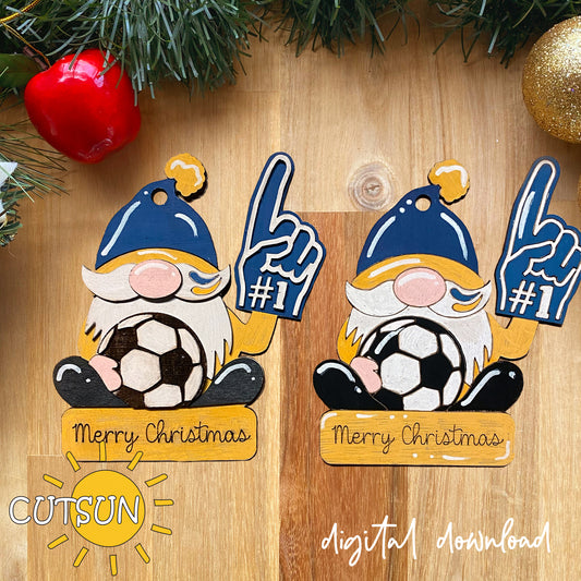 Two Christmas gnome ornaments with soccer balls on a wooden surface, featuring 'CUTSUN' branding.
