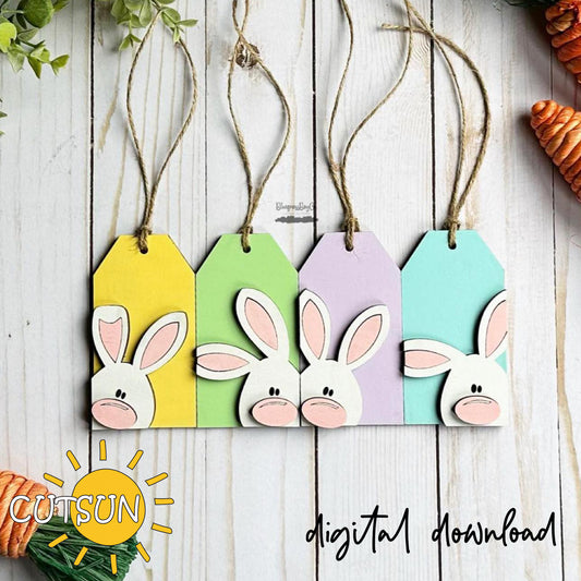 Colorful bunny face tags hanging on a wooden surface with 'CUTSUN' branding.