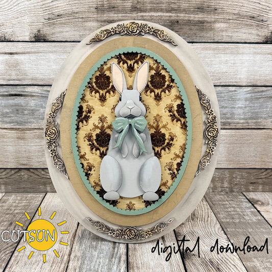Vintage oval frame SVG laser cut file with Easter Bunny portrait insert and engraved damask background for interchangeable decor.