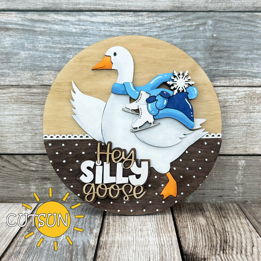 Winter-themed goose door hanger with scarf, mittens, hat, and ice skates – laser cut file from CutsunSVG