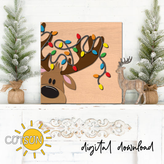 Digital download for a square or rectangle leaning sign featuring a cute reindeer with Christmas lights around its antlers.