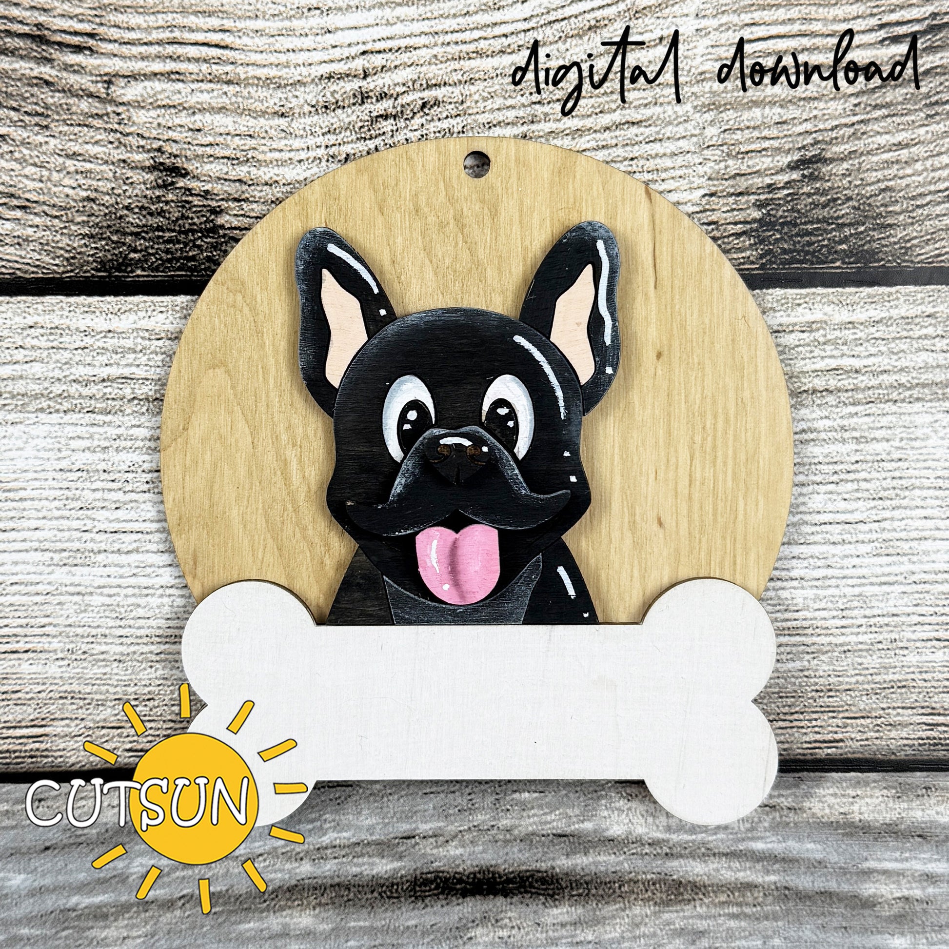 Layered French Bulldog Christmas ornament SVG with festive hat options and customizable bone nameplate for laser cutting.