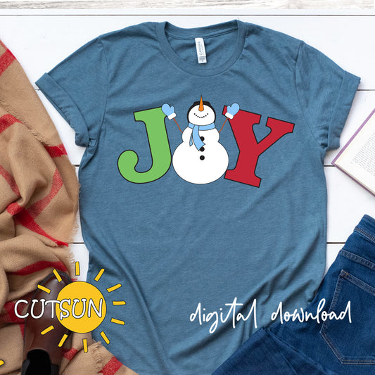 Blue t-shirt with a snowman design spelling 'JOY' on a white surface.